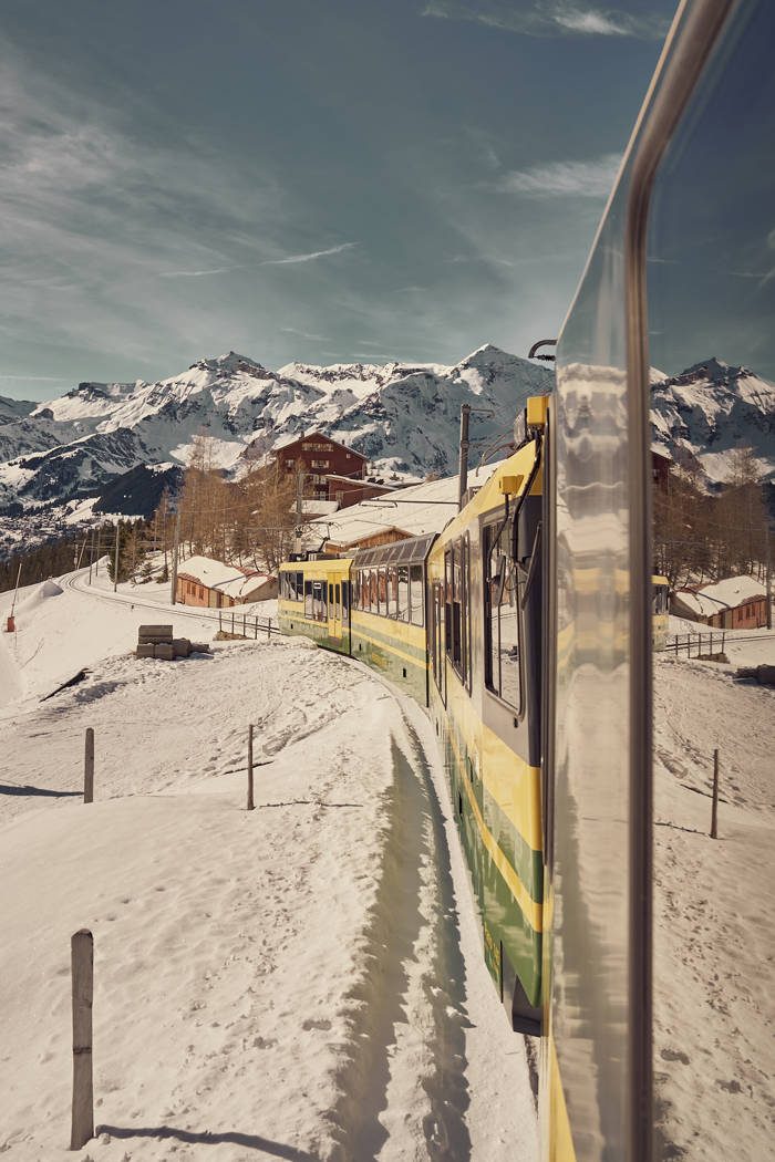 View from a cogwheel train window over Wengen and the valley
