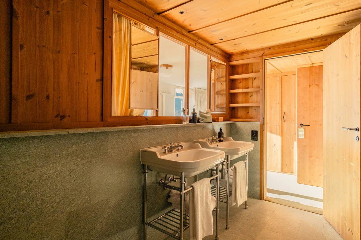 A Junior Suite with a living area in wood and soft textiles