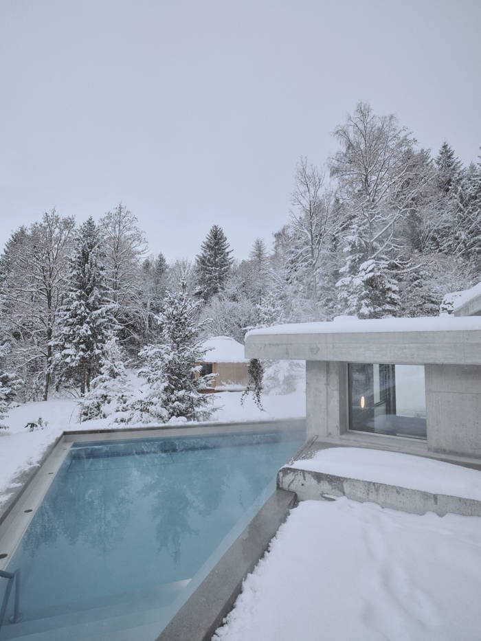 The outdoor pool steaming in deep snow