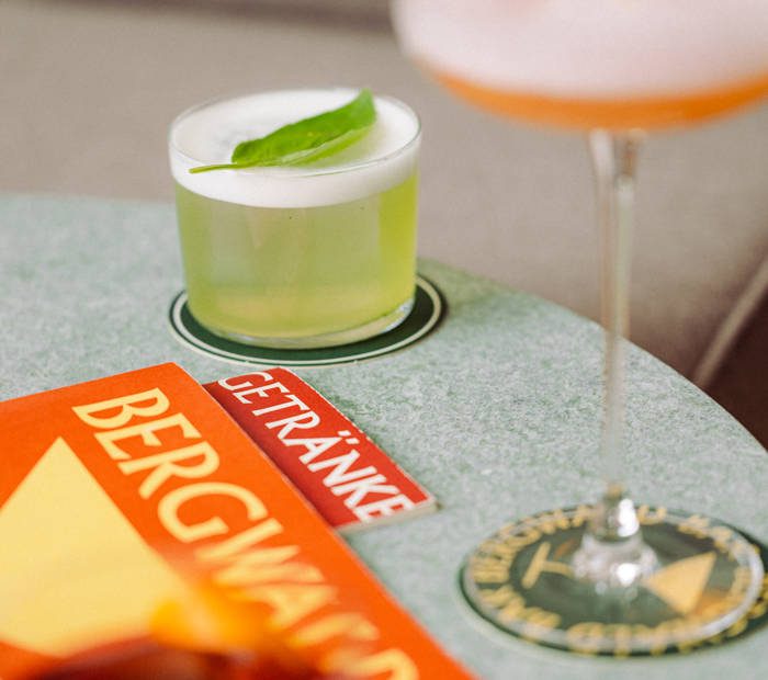 A green cocktail on the Bergwald drinks card